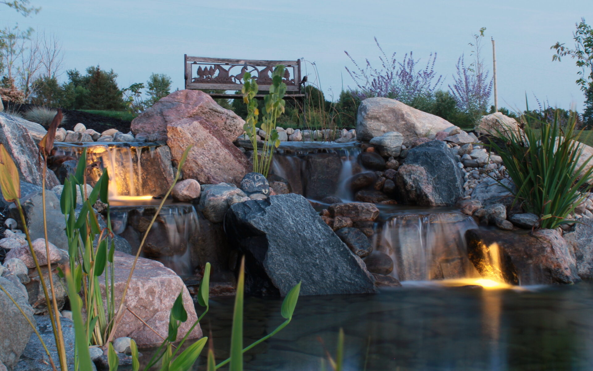 Waterfall at dusk landscape backyard