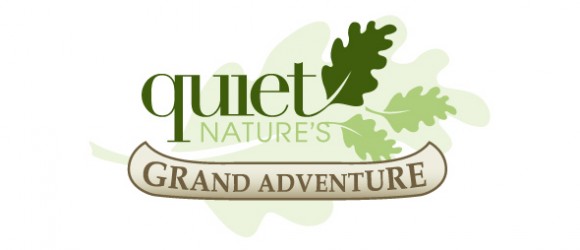 The image shows a logo with stylized text "Quiet Nature's Grand Adventure," surrounded by green leaf illustrations, implying an outdoor or nature theme.