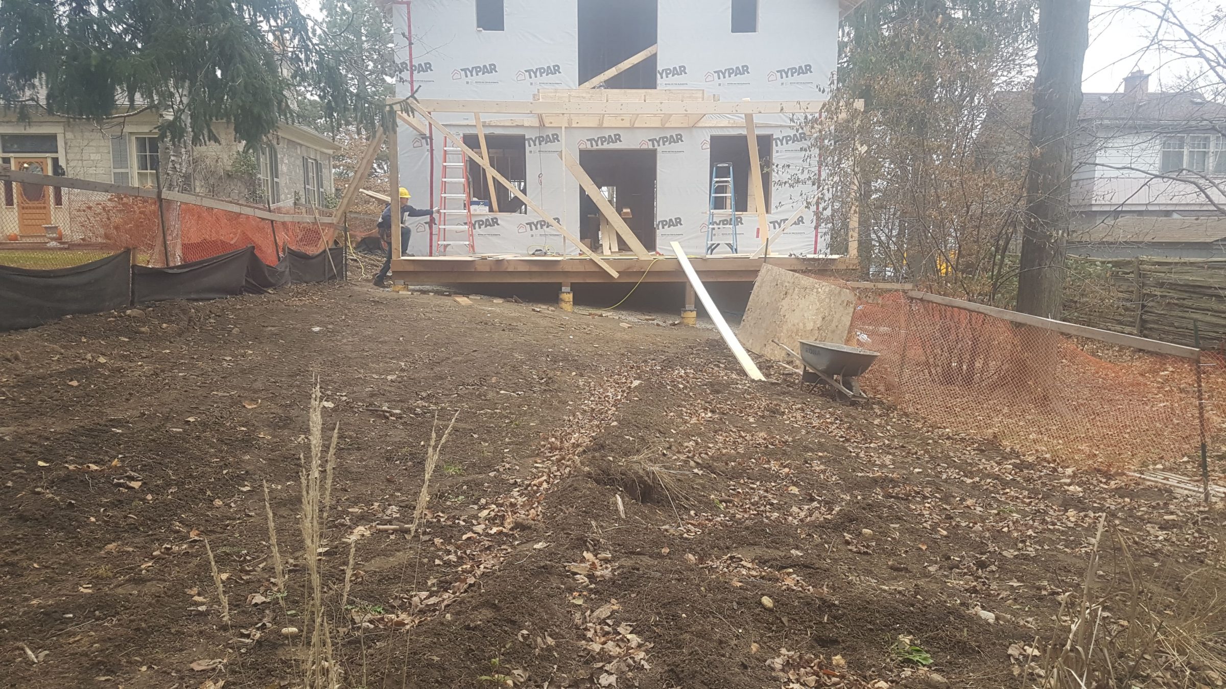 Rear yard at The Junction in Guelph showing rough grading and the home addition before the landscape installation was completed.