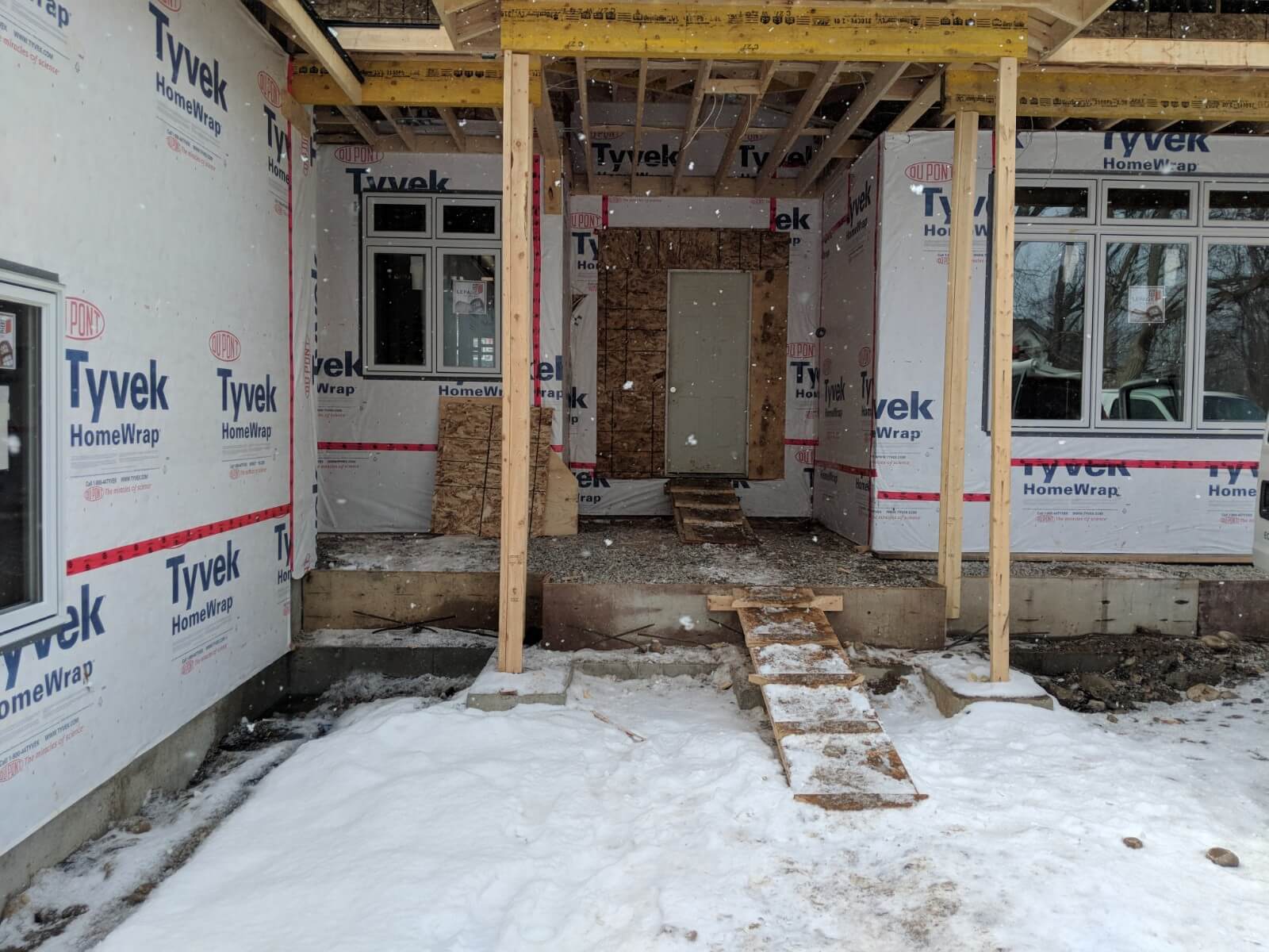 Muddy construction driveway leading to the partially built home in a residential heritage neighbourhood
